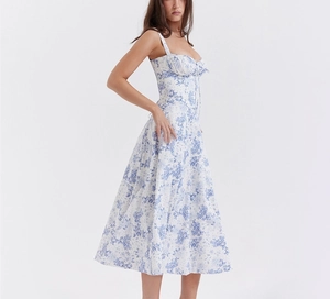 Detailed close-up of blue floral print dress with pleated bust and tie-up neckline