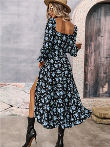 Detailed back view of a floral bohemian dress with elegant open back and high side slit
