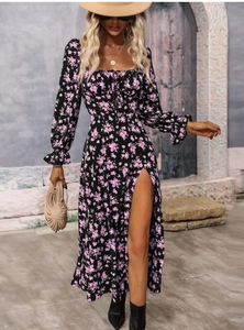 Detail of floral bohemian dress featuring flare sleeves and a high side slit design