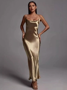 Elegant gold satin backless maxi dress with slim fit and silky fishtail silhouette