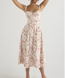 Detail of floral backless dress showing rose prints, drawstring bust and side slit