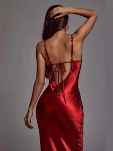 Elegant red satin backless slip dress with thin straps and tie-back detailing