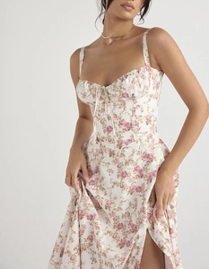 Close-up of floral corset-style dress featuring a high side slit and delicate rose print