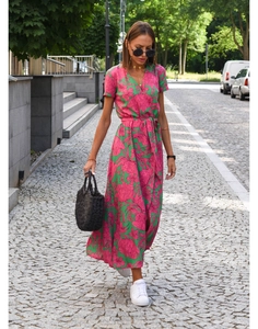 Detail of floral print V-neck dress showing waist tie and lightweight fabric texture