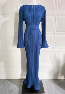 Detail view of the blue pleated dress with elegant flared sleeves and round neckline
