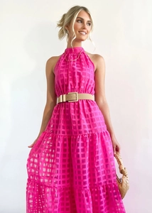 Detailed view of hot pink plaid halter neck dress with layered ruffle skirt and belt