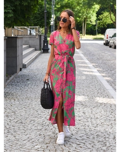 Detail of V-neckline and waist tie on women's floral summer maxi dress in pink and green