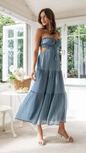 Detail of blue backless tiered maxi dress with side cutouts and ruched drawstring bodice