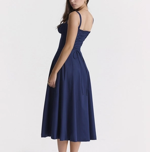 Detail of navy floral midi dress featuring adjustable lace-up back and slim-fit bodice