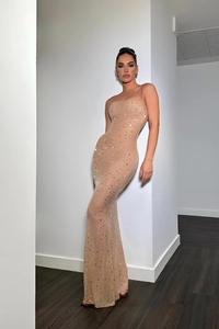 Detailed view of shimmering sequins and beaded patterns on a nude mermaid evening gown