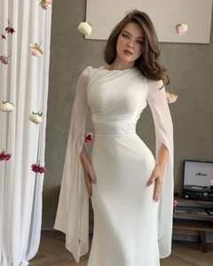 Detail of elegant white slim-fit dress featuring pleated neckline and split cape sleeves