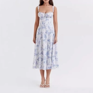 Blue floral summer midi dress with sweetheart neckline and front tie detail for vacation