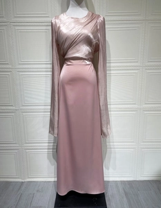 Detail of the elegant dusty pink satin dress featuring pleated overlapping bust design