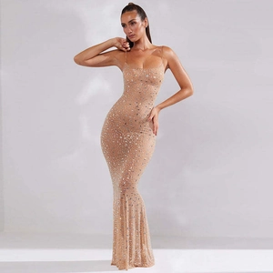 Detail of champagne mermaid dress with shimmering silver sequins and slim fit spaghetti straps