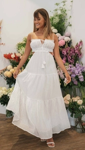 Close-up of white tiered maxi dress with spaghetti straps and pleated bust detail