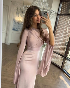 Detail of mauve slim-fit evening dress featuring pleated bodice and split flare sleeves