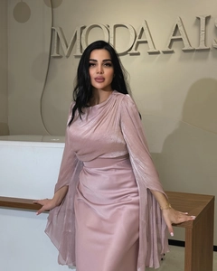 Detail of glittery pink dress with elegant high neck and split batwing sleeves