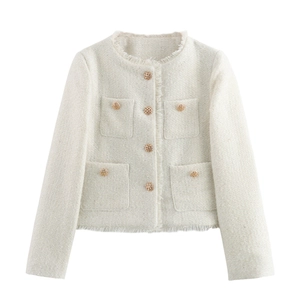 Detailed view of cream tweed jacket featuring gold hollow buttons and fringe hem details