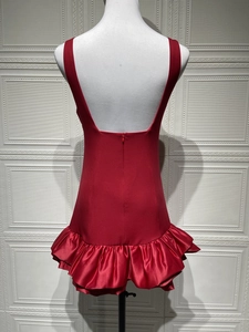 Detailed back view of a slim fit red halter dress showing U-shaped open back and ruffled hem