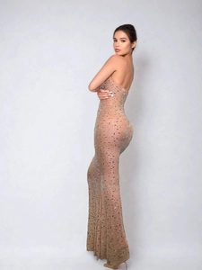 Elegant backless mermaid evening gown with shimmering sequins and thin straps for women