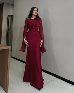 Detailed macro view of the burgundy batwing sleeve dress with pleated fabric texture
