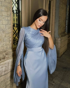 Detail of light blue pearlescent evening dress with cape sleeves and pleated bodice