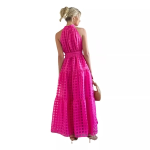Fashionable rose red halter maxi dress with textured checkered fabric and tiered skirt