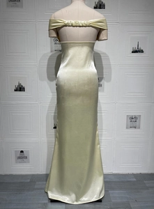 Detail view of the elegant back design with gathered pleats on this satin fishtail gown