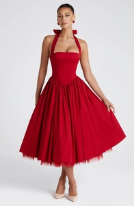Detail of red evening dress with halter neck tie and large bow on the back