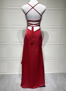 Detailed back view of sexy backless red satin dress with crisscross lace-up straps