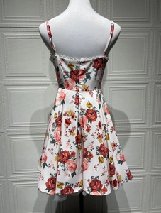 Detailed back view of a satin floral dress featuring a hidden zipper and lace trim