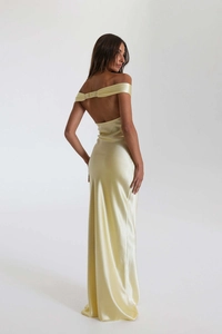 Detailed view of champagne satin dress showing off-the-shoulder design and ruched back strap