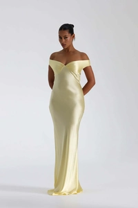 Detail of off-shoulder pleated bodice on a premium light yellow satin fishtail evening gown