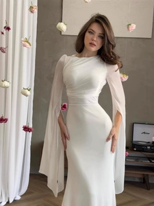 Elegant white slim fit dress with round neck, pleated chest and split cape sleeves