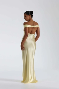 Detail of elegant backless satin evening gown featuring ruched strap and fishtail hem