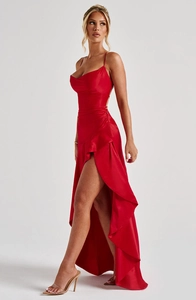 Detail showing the red satin evening dress with cowl neck and elegant ruffle hem