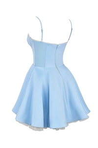 Detail of light blue satin mini dress showing white lace trim and layered mesh petticoat