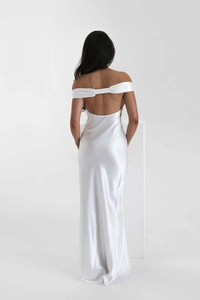 Detail of elegant off-the-shoulder back on a white satin fishtail evening gown
