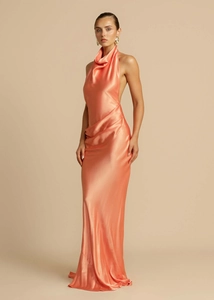 Detailed view of cowl neck and draped satin fabric on backless coral pink halter maxi dress