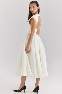 Detailed back view of white sleeveless backless dress with a flared voluminous skirt