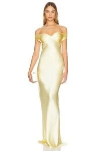 Detailed close-up of pale yellow satin evening gown with elegant off-shoulder neckline