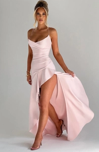 Detailed close-up of the satin texture and draped ruffles on this light pink evening dress