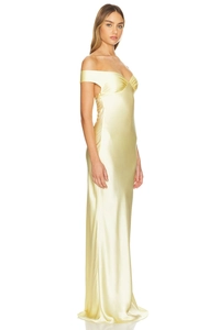 Detail showing high-shine pale yellow satin fabric and pleated off-shoulder neckline