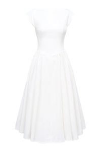 Detailed texture of white backless pleated dress with elegant boat neck and a-line silhouette
