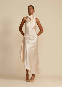 Detail of elegant champagne satin dress featuring a halter neck and draped bodice design