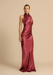 Detail of elegant backless burgundy satin maxi dress with cowl neck and side slit