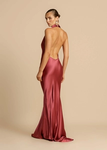 Detail of burgundy satin backless maxi dress with halter neck and elegant fabric drape
