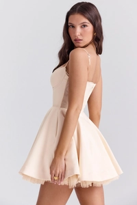Detail of satin corset dress showing the layered tulle underskirt and A-line silhouette