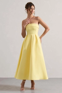 Détail de la robe midi jaune bustier avec taille plissée et jupe évasée en ligne A