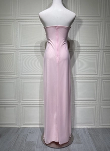 Back view detail of pink strapless maxi dress with invisible zipper on mannequin